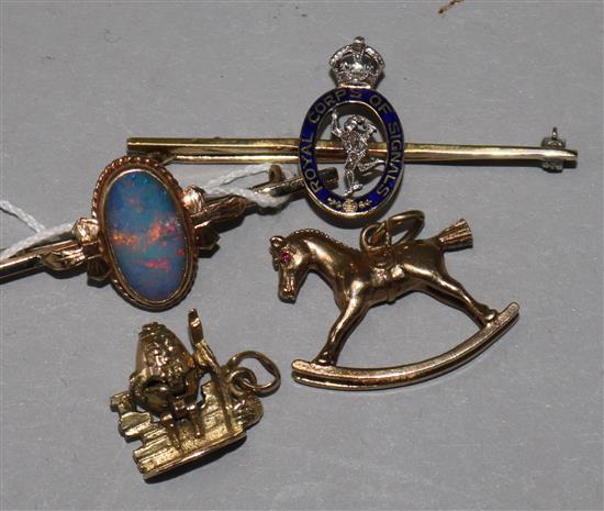 A 15ct gold, enamel and diamond set Royal Corps of Signals brooch, two 9ct gold charms & a 9ct gold brooch.